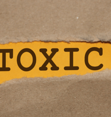 The word "toxic" against and orange and brown backdrop for a blog article about toxic cycles.