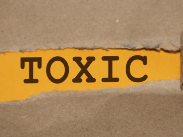 The word "toxic" against and orange and brown backdrop for a blog article about toxic cycles.